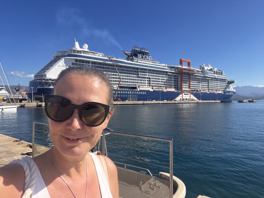 the author standing in front of the Celebrity Beyond Cruise Ship
